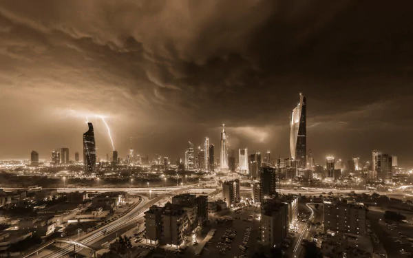 A dramatic view of Kuwait City illuminated by lightning, showcasing the stunning man-made skyline against a moody sky, creating a captivating urban scene.