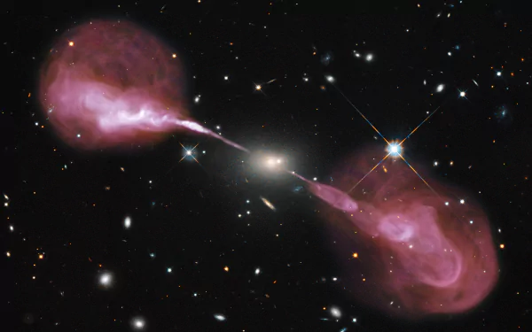 A stunning Hubble image of a radio galaxy, featuring vibrant pink jets emanating from a central black hole, set against a backdrop of distant stars and galaxies.
