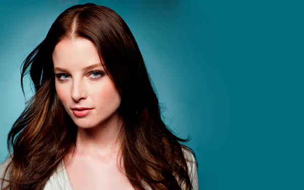 Portrait of American actress Rachel Nichols with blue eyes and brunette hair against a teal background, rendered in 4K Ultra HD quality.