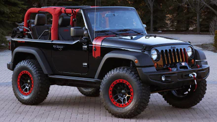 A black Jeep Wrangler concept car with red accents and large tires, showcasing its 4x4 capabilities. The image serves as a striking HD desktop wallpaper.