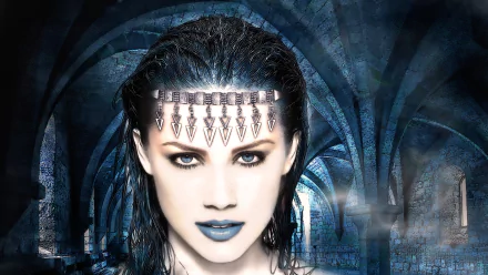 A fantasy-themed HD PC wallpaper featuring a woman with striking blue eyes and dark makeup, set against a mysterious castle backdrop with arched corridors.
