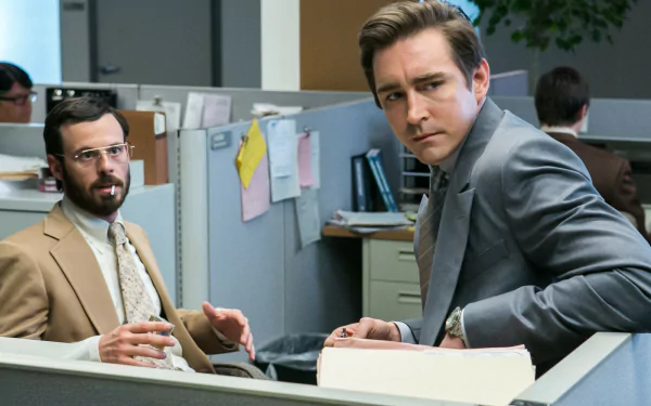 HD desktop wallpaper of characters from Halt And Catch Fire in an office setting, featuring actors associated with the roles of Joe MacMillan and Gordon Clark.