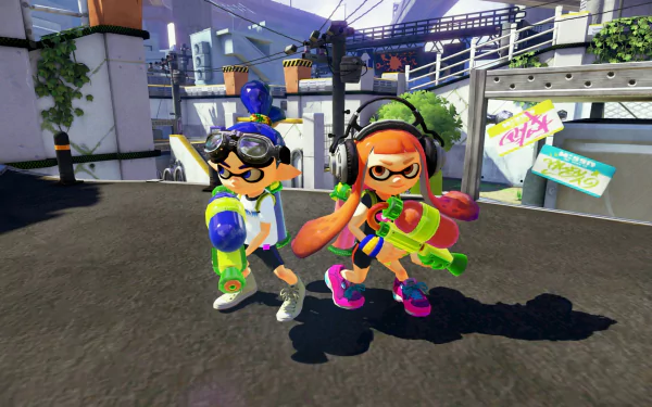 HD Splatoon wallpaper featuring two Inklings with paint guns, ready for action on a vibrant battlefield.