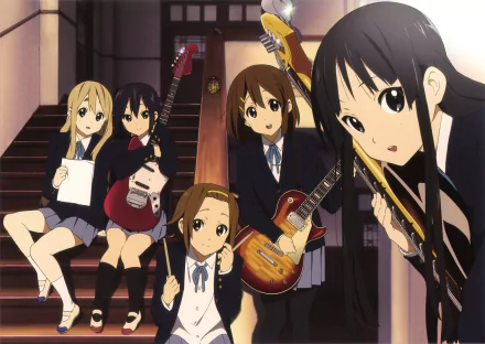 A HD desktop wallpaper featuring characters Azusa Nakano, Tsumugi Kotobuki, Ritsu Tainaka, Yui Hirasawa, and Mio Akiyama from the anime K-ON!, all in school uniforms with musical instruments.