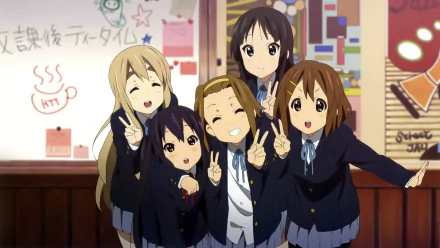 A colorful HD wallpaper featuring characters Azusa Nakano, Tsumugi Kotobuki, Ritsu Tainaka, Yui Hirasawa, and Mio Akiyama from the anime K-ON!, dressed in school uniforms and posing joyfully.