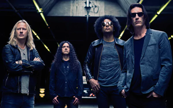 HD PC desktop wallpaper featuring the rock band Alice In Chains standing in a dark, industrial setting, embodying their iconic music style and intense presence.