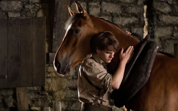 HD PC desktop wallpaper featuring a touching scene from the movie War Horse, showing a boy embracing a horse in a rustic setting.