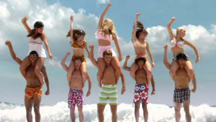 HD PC desktop wallpaper background from the movie Teen Beach Movie: five young men carry five young women on their shoulders, all in colorful beachwear, cheering on a sunny ocean shore.