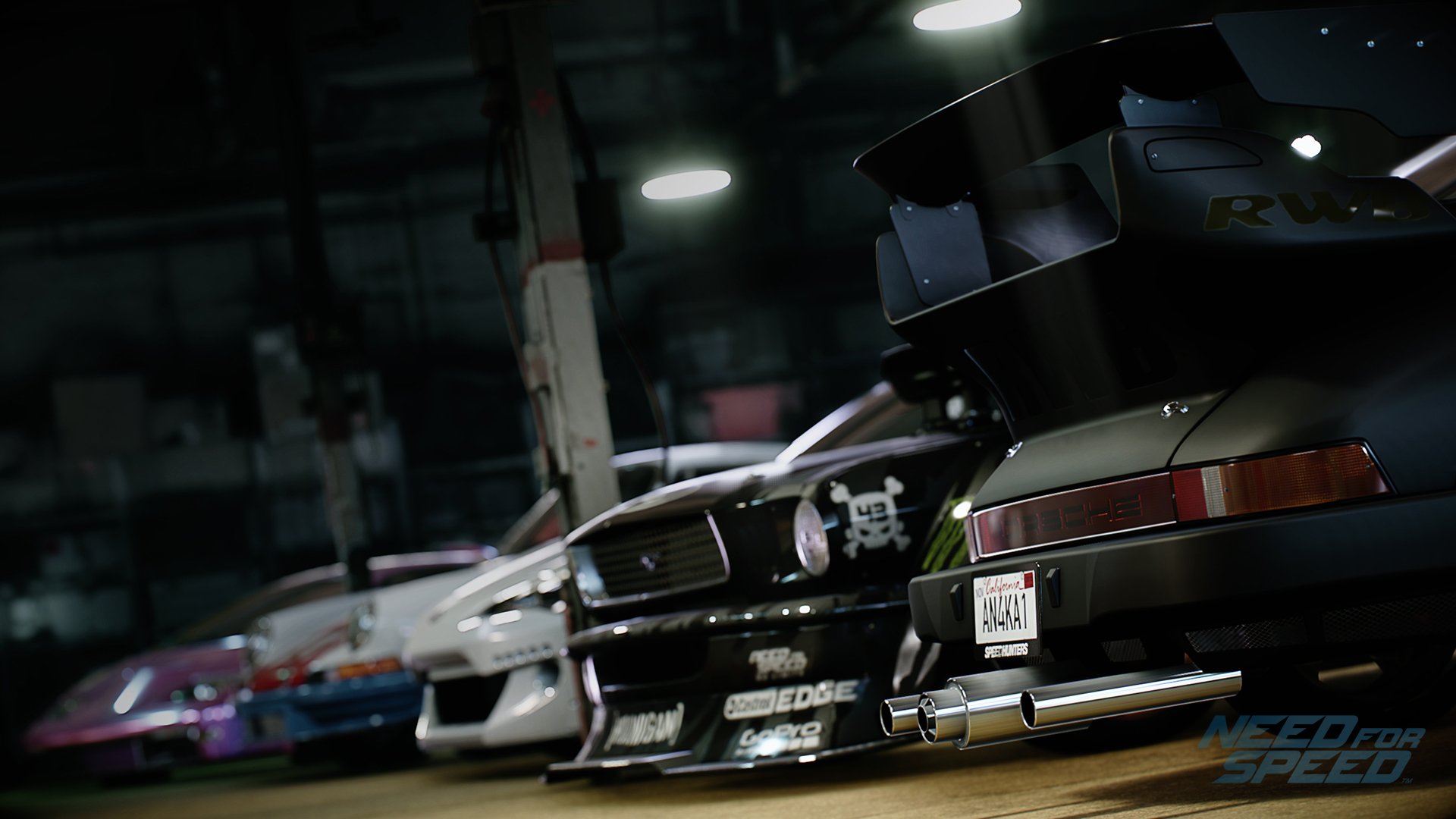 A dynamic HD wallpaper featuring sleek cars from Need For Speed (2015) showcased in a garage setting, highlighting the vibrant automotive culture of the game.
