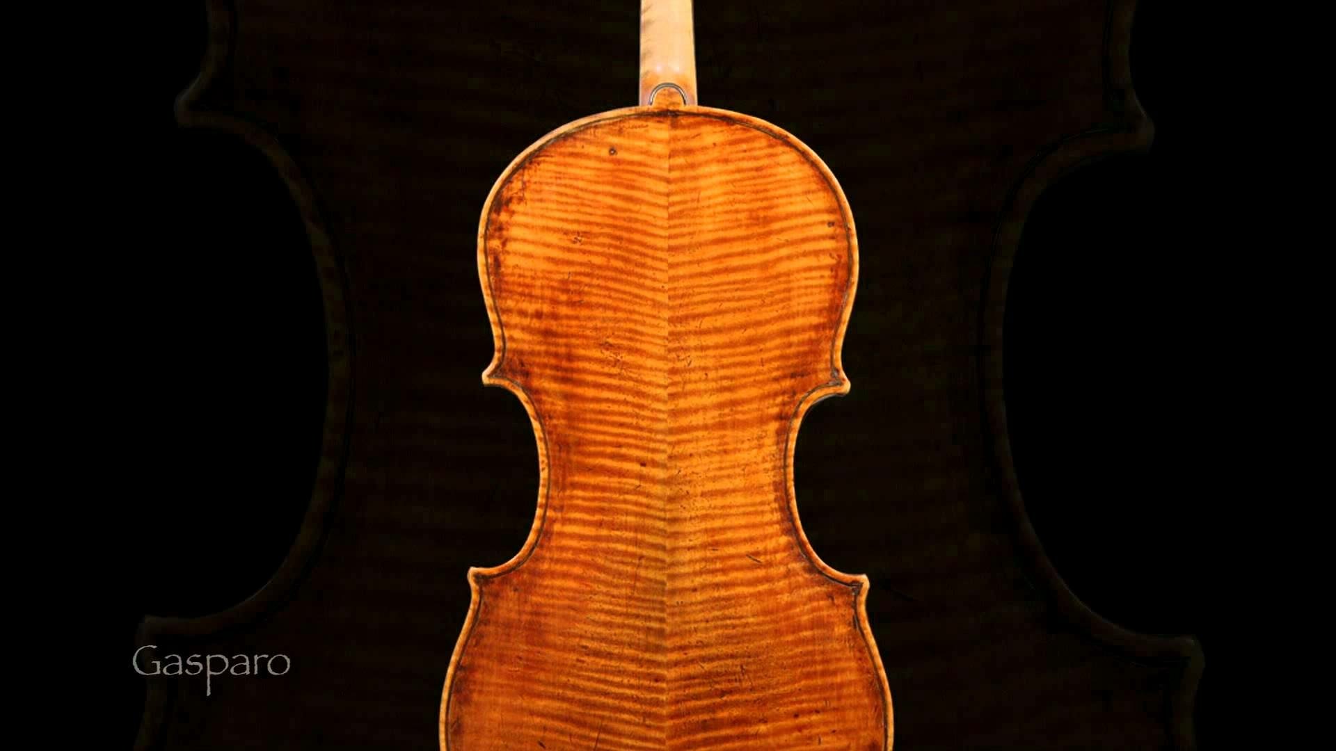 Music, violin HD PC desktop wallpaper: close-up of a violin's flamed maple back glowing warm orange against a black background.