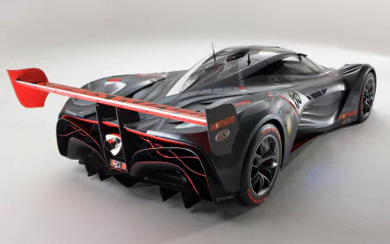 High-detail HD PC desktop wallpaper of a Mazda Furai vehicle: sleek black-and-red concept race car seen from a rear three-quarter view.