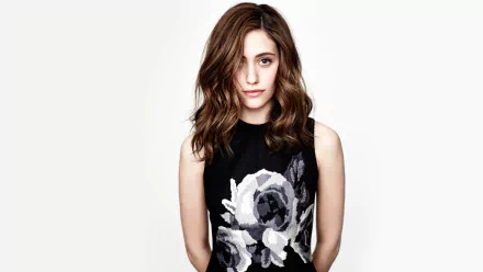 HD PC desktop wallpaper featuring celebrity Emmy Rossum wearing a black dress with white floral patterns against a plain white background.