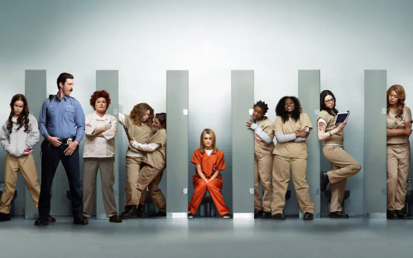A dynamic HD wallpaper featuring characters from the TV show Orange Is the New Black, showcasing a mix of inmates and staff in a prison setting, highlighting their diverse personalities.