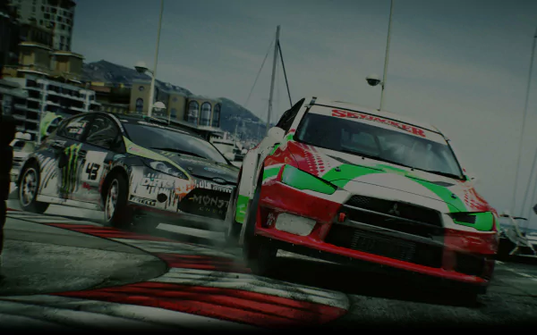 HD PC desktop wallpaper featuring intense rally racing action from the video game DiRT 3, showcasing dynamic cars navigating a sharp turn on the track.