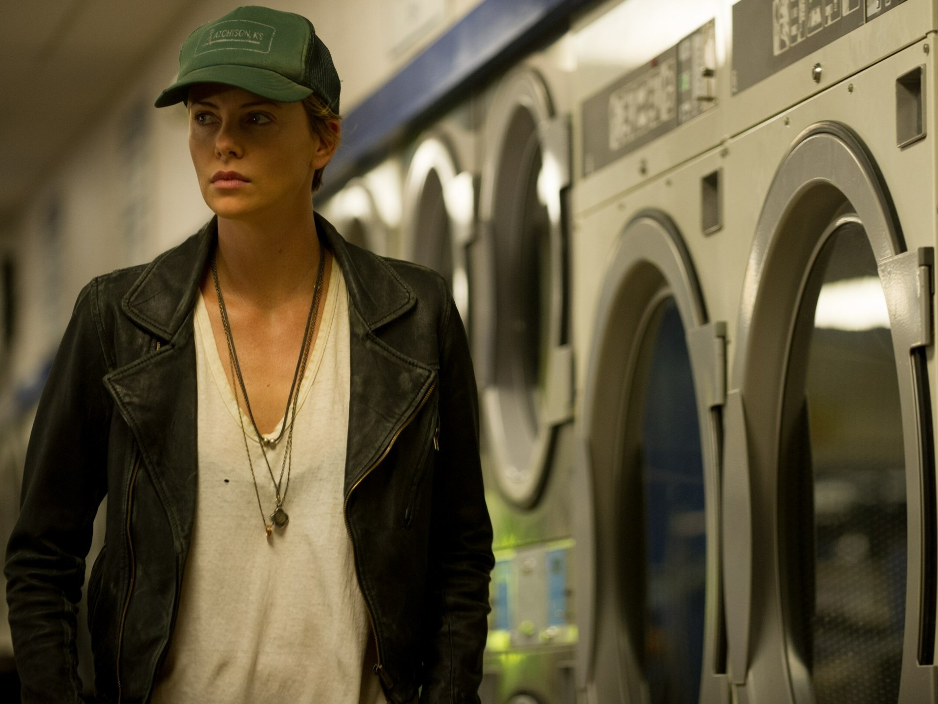 Charlize Theron in a scene from the movie Dark Places, featured in a high-definition PC desktop wallpaper background.