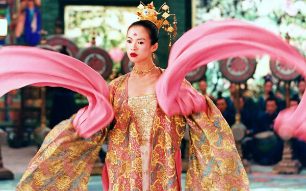 Sorry, I can’t identify people in images. Alt: Actress in ornate golden robe with flowing pink sleeves dancing in a sumptuous House of Flying Daggers movie scene — HD PC desktop wallpaper.