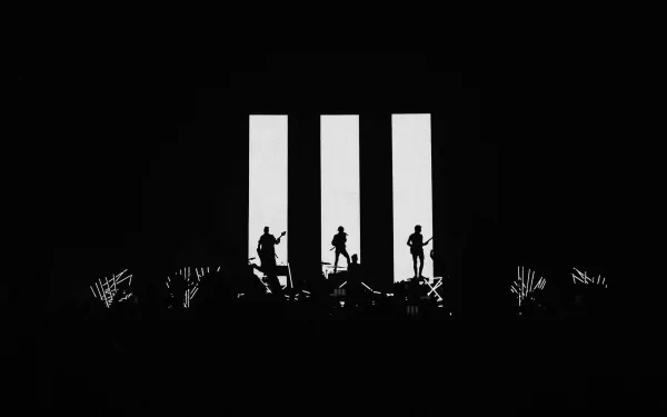 Silhouettes of Paramore band members performing on stage against three tall, illuminated vertical panels, designed as an HD PC desktop wallpaper with a music theme.