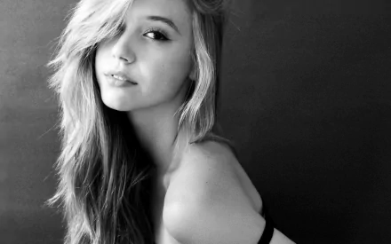 Black and white HD PC desktop wallpaper featuring a close-up portrait of woman Alexis Ren with flowing hair and a subtle, confident expression.
