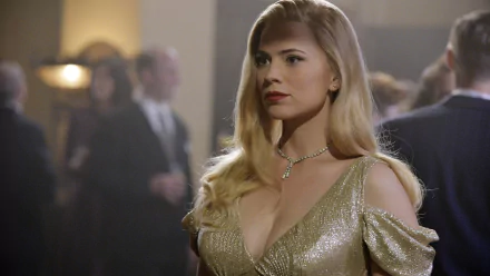 Hayley Atwell shines in a glamorous gold dress, embodying her character from the TV show Agent Carter. The image captures a refined, vintage-inspired atmosphere.