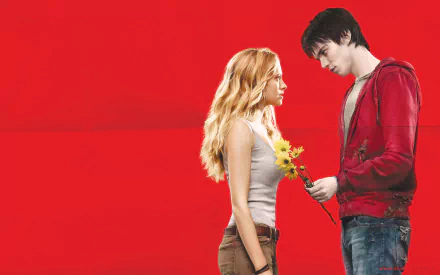 Nicholas Hoult and Teresa Palmer in a scene from the movie Warm Bodies, featuring a striking red background and a moment of connection between their characters.