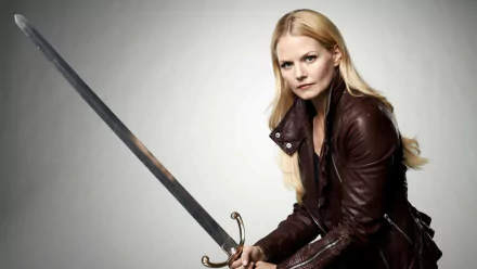 Emma Swan from the TV show Once Upon A Time, poses fiercely with a sword, showcasing her strength and determination against a minimalist background. A striking HD desktop wallpaper.