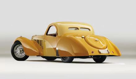 HD PC desktop wallpaper featuring a yellow Bugatti Type 57sc Electron Atlantic Coupe, showcasing the classic design and elegance of this vintage vehicle.