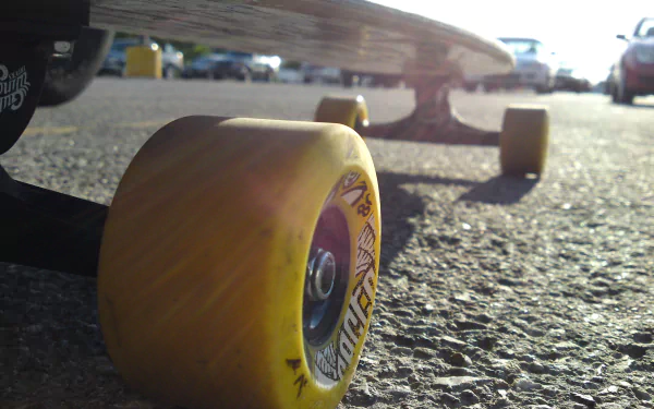 A close-up view of a skateboard wheel on pavement, capturing the essence of skateboarding and sports. This vibrant HD image serves as a dynamic desktop wallpaper.