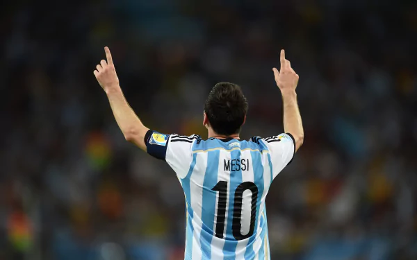 HD desktop wallpaper featuring Lionel Messi, wearing the number 10 jersey for Argentina, raising his arms in celebration on the sports field.