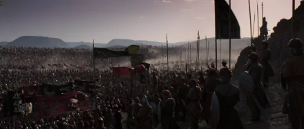 HD PC desktop wallpaper/background: cinematic battle scene from the movie Kingdom of Heaven — vast medieval army with banners and spears stretching toward distant hills at dusk.