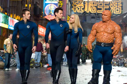 A vibrant HD wallpaper featuring the Fantastic Four—Mister Fantastic, Invisible Woman, Human Torch, and Thing—portrayed by Chris Evans, Ioan Gruffudd, and Jessica Alba.