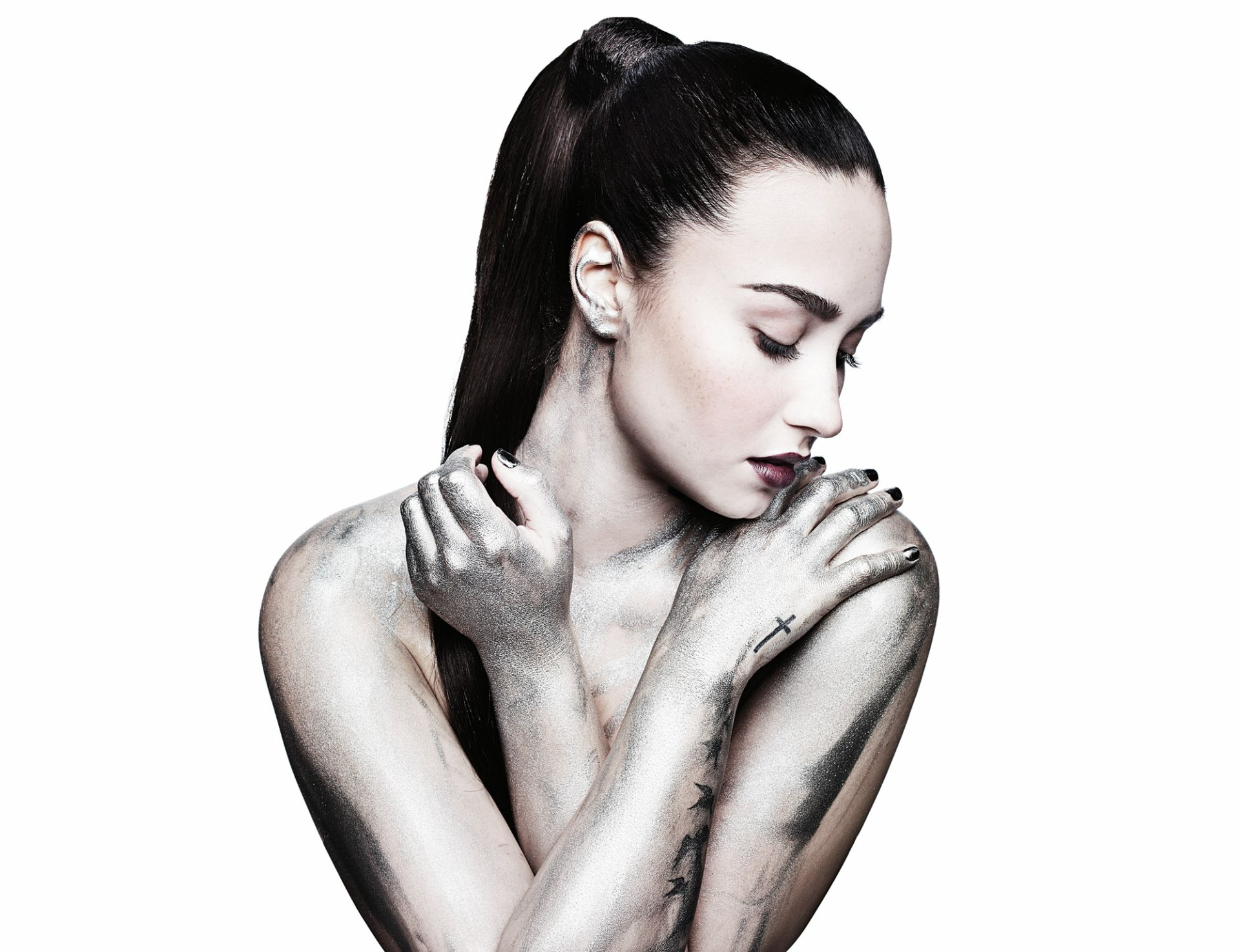 HD PC desktop wallpaper featuring a black and white portrait of Demi Lovato in a reflective pose, highlighting themes of music and emotion.