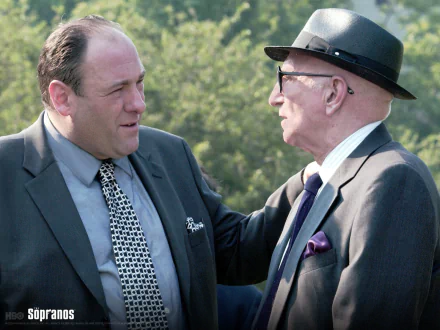 HD PC desktop wallpaper: Tony Soprano (The Sopranos) in a suit conversing with an older man in a fedora outdoors.