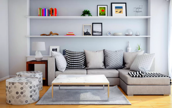 Modern interior of a man-made room featuring a sectional sofa, patterned cushions, a coffee table, decorative shelves, and soft natural lighting in 4K Ultra HD quality.