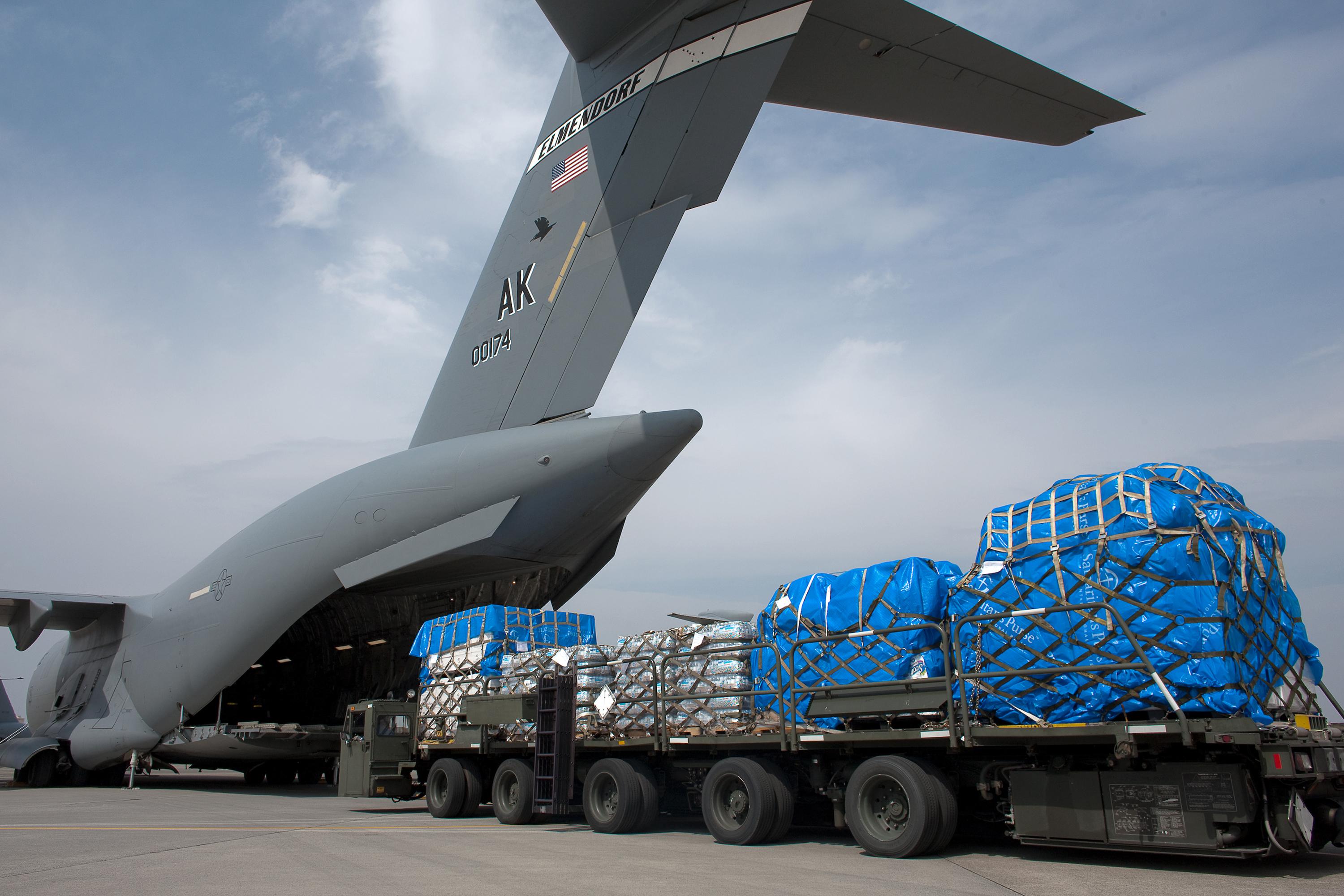 Loading Humanitarian Relief Supplies to be Delivered to Sendai, Japan by Yasuo Osakabe