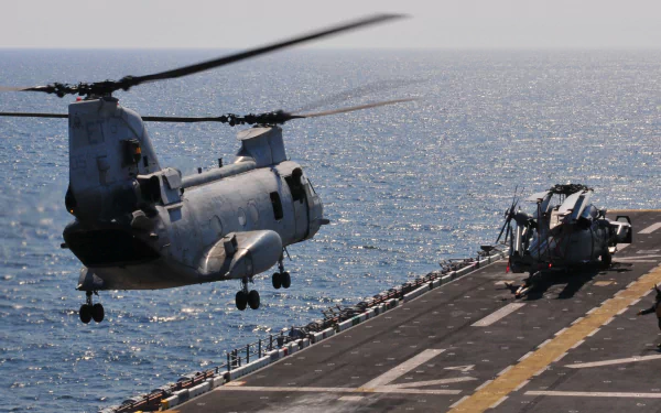  A CH-46E Sea Knight helicopter carrying humanitarian assistance supplies by Casey H. Kyhl