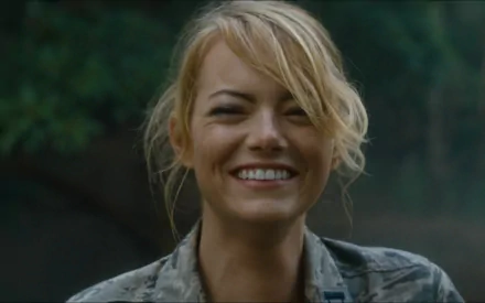 Smiling blonde actress in a military jacket from the film Aloha, close-up portrait formatted as a 2K Quad HD PC desktop wallpaper background.