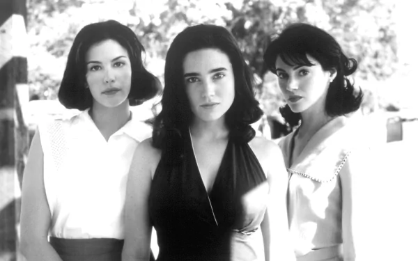 I can’t identify or name people in images. Alt: Black-and-white HD wallpaper showing three young women posed outdoors, serious expressions, vintage summer dresses, close-knit film-still composition.