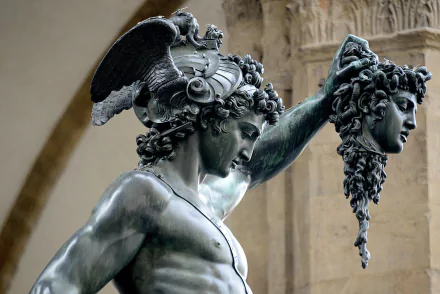 HD PC desktop wallpaper featuring a detailed man-made statue of Perseus holding Medusa's head, showcasing intricate craftsmanship and classical artistry.