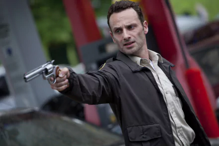 Rick Grimes, played by Andrew Lincoln in The Walking Dead, aims a gun intensely in this 4K Ultra HD PC desktop wallpaper and background.