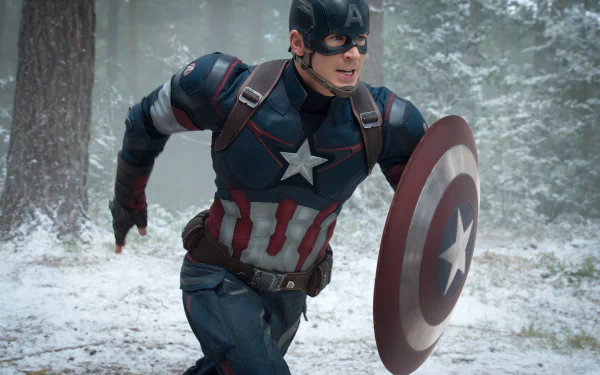 Chris Evans as Captain America rushes into action, wielding his iconic shield in a snowy landscape from Avengers: Age of Ultron. A striking HD wallpaper capture.