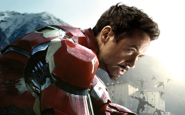 Iron Man, portrayed by Robert Downey Jr., gazes intently in this HD wallpaper from Avengers: Age of Ultron, showcasing his iconic suit against a dramatic backdrop.