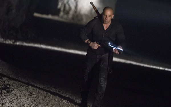 Brooding hunter in a dark tunnel wielding a glowing blade, cinematic still from The Last Witch Hunter — 5K Ultra HD PC desktop wallpaper and background.