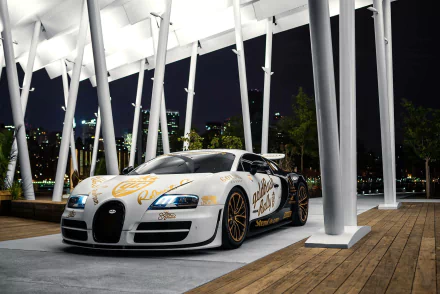 A stunning Bugatti Veyron showcased at night, featuring a striking design. This HD wallpaper captures the luxury and power of this iconic supercar against a sleek urban backdrop.