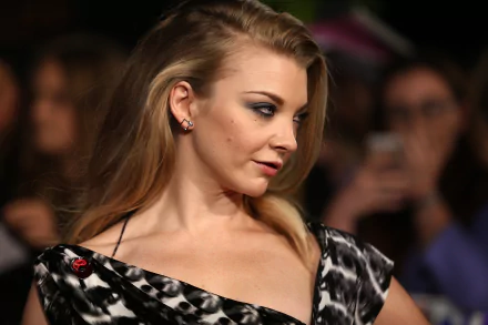 A stunning 4K Ultra HD image featuring actress and model Natalie Dormer, showcasing her elegant profile at an event, with fans and cameras in the background.