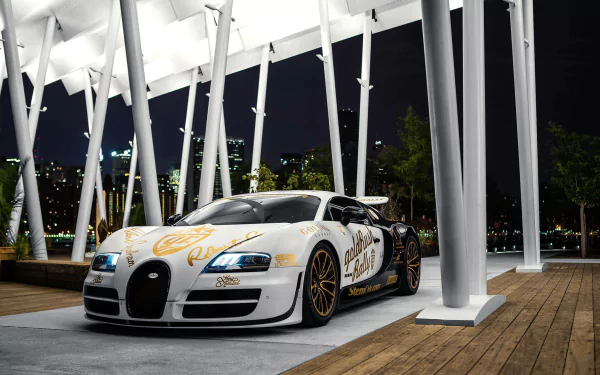 A stunning Bugatti Veyron showcased at night, featuring a striking design. This HD wallpaper captures the luxury and power of this iconic supercar against a sleek urban backdrop.