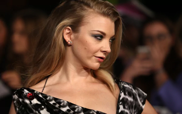 A stunning 4K Ultra HD image featuring actress and model Natalie Dormer, showcasing her elegant profile at an event, with fans and cameras in the background.