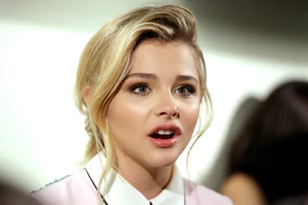 Close-up of celebrity Chloë Grace Moretz with a natural expression, captured in 4K Ultra HD quality for PC desktop wallpaper and background.