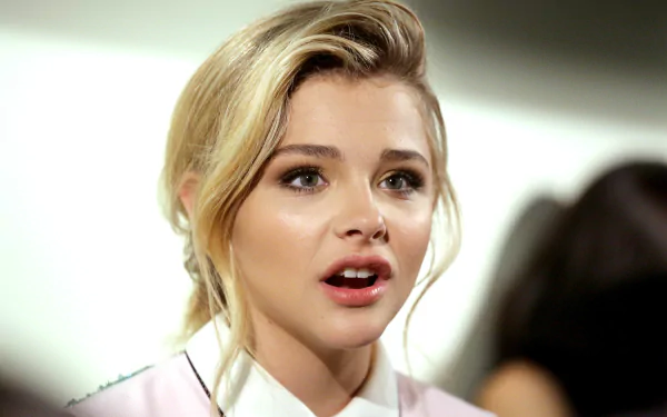Close-up of celebrity Chloë Grace Moretz with a natural expression, captured in 4K Ultra HD quality for PC desktop wallpaper and background.