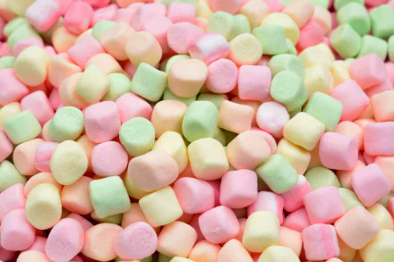 Colorful pastel mini marshmallows filling the frame in a vibrant 4K Ultra HD desktop wallpaper showcasing soft textures and sweet food detail.
