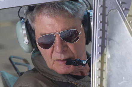 Close-up of a gray-haired pilot wearing a headset and aviator sunglasses inside a helicopter — 4K Ultra HD PC wallpaper inspired by The Expendables 3 character Max Drummer